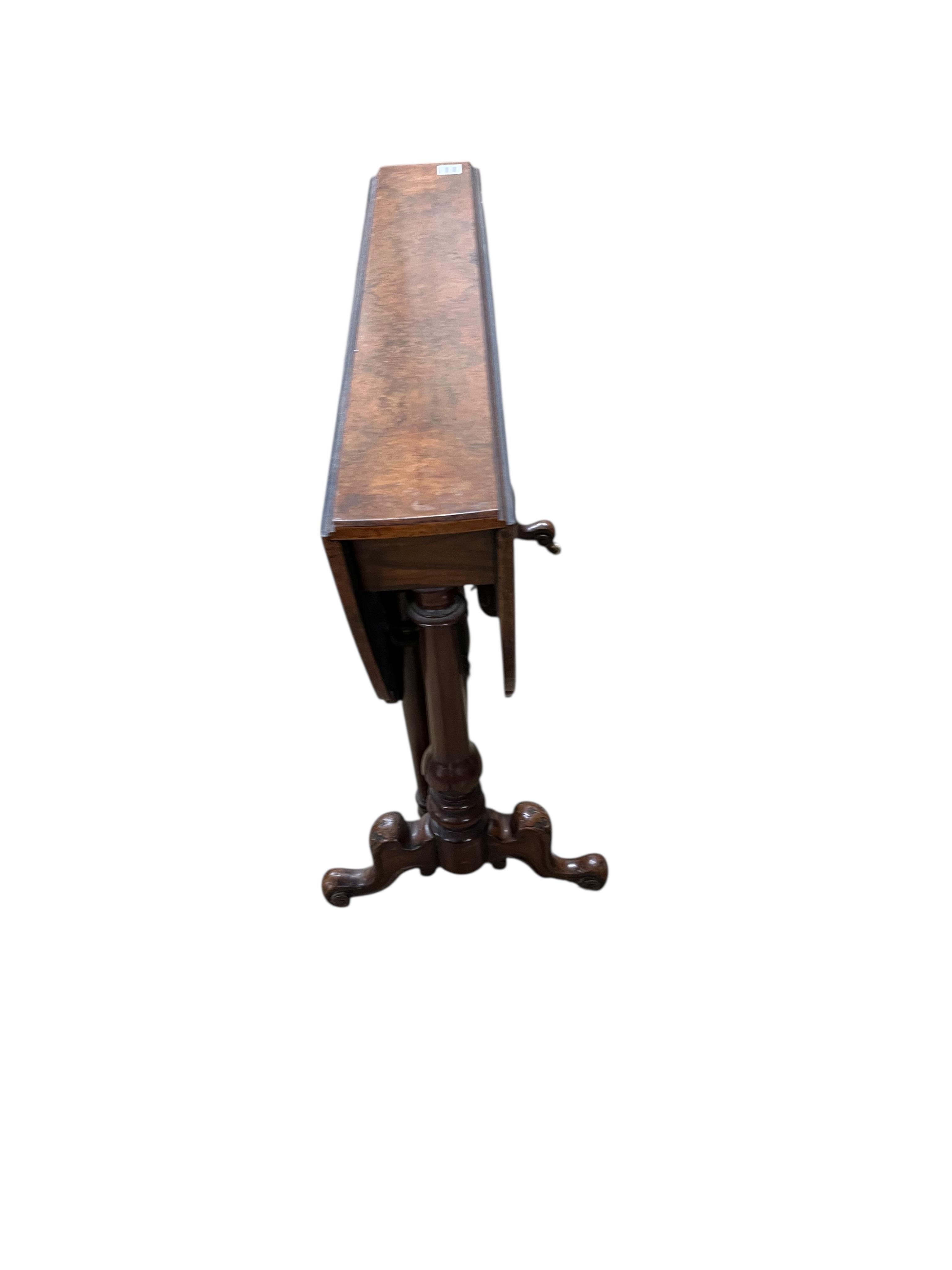 A Victorian walnut Sutherland table, width 92cm, height 68cm